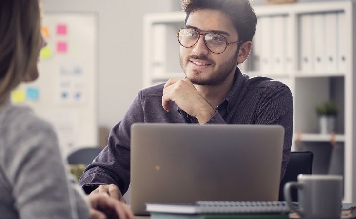 Broker discusses life insurance recommendations with a client.