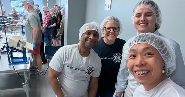 Smiling group of employees at Feed My Starving Children