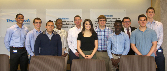 Trustmark CEO Kevin Slawin and members of the internship program