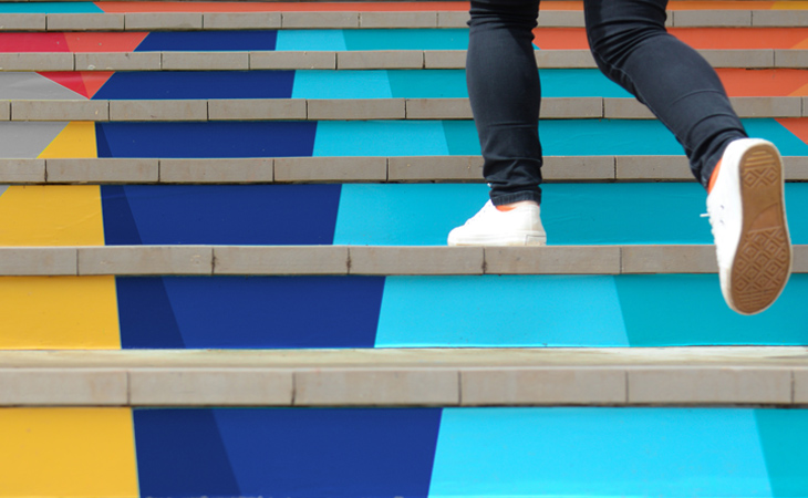 Person running up steps